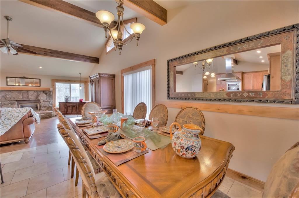 898 Deer Path Road Dillon, CO 80435 - Photo 11 of 34 a view of a dining room with furniture and wooden floor