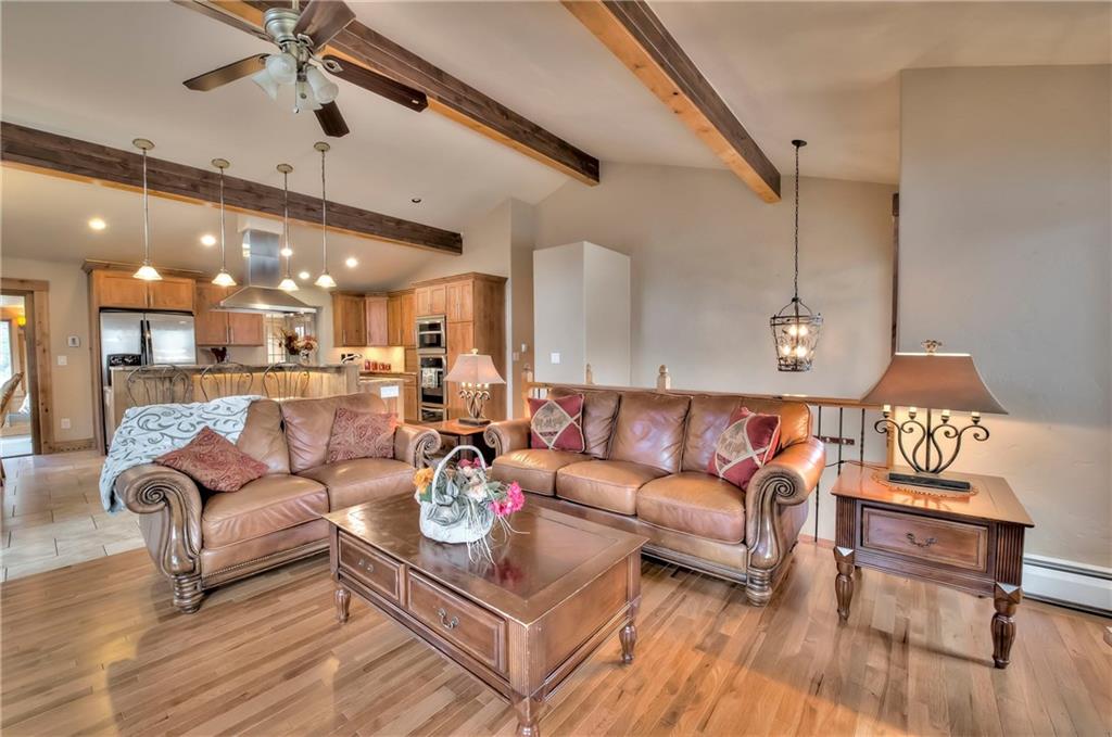 898 Deer Path Road Dillon, CO 80435 - Photo 18 of 34 a living room with furniture kitchen view and a wooden floor