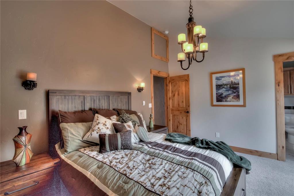 898 Deer Path Road Dillon, CO 80435 - Photo 20 of 34 a bedroom with bed and wooden floor