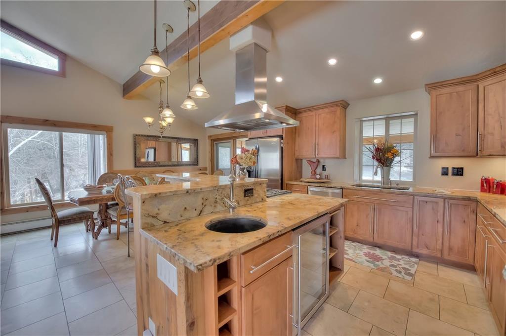 898 Deer Path Road Dillon, CO 80435 - Photo 3 of 34 a kitchen with a sink a counter top space and appliances
