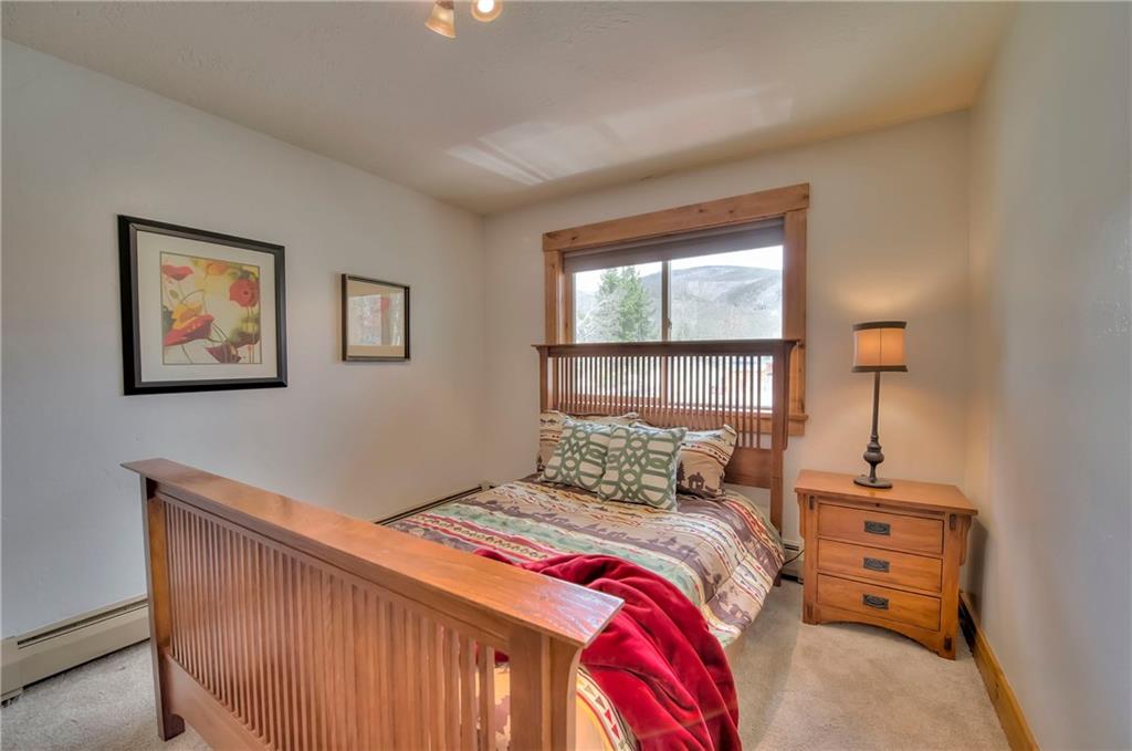 898 Deer Path Road Dillon, CO 80435 - Photo 22 of 34 a bedroom with a bed and a window