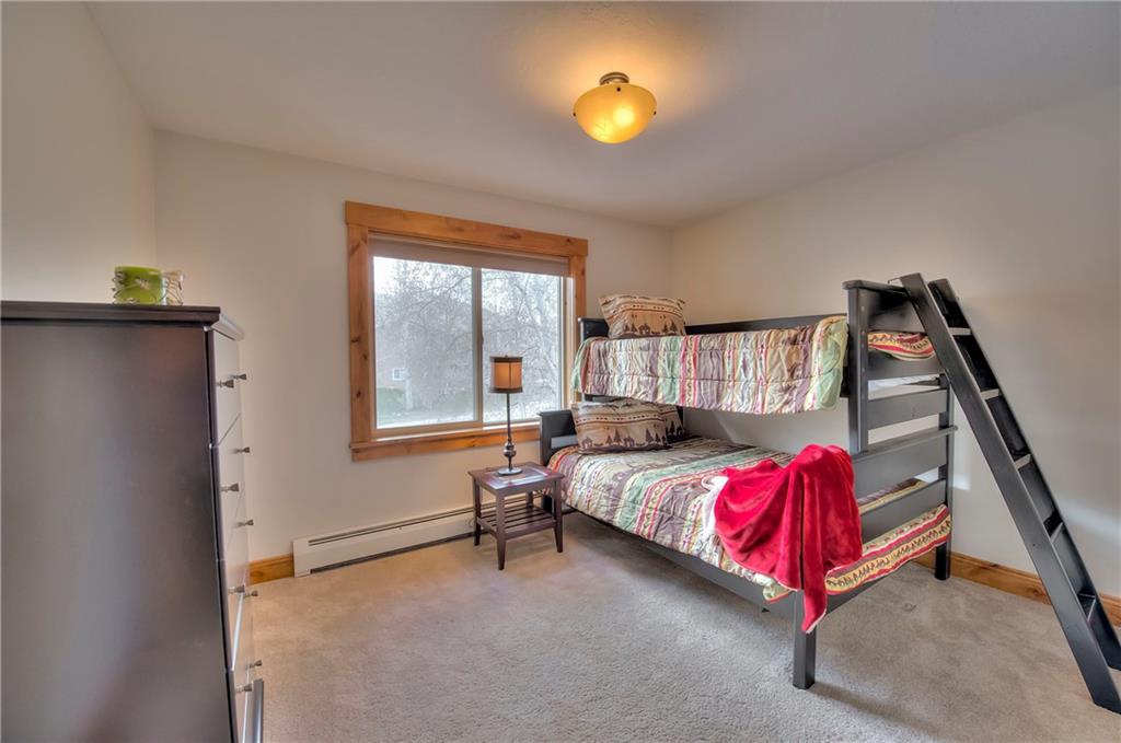 898 Deer Path Road Dillon, CO 80435 - Photo 23 of 34 a bedroom with a bed and window