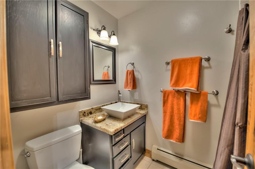 898 Deer Path Road Dillon, CO 80435 - Photo 24 of 34 a bathroom with a sink and a mirror