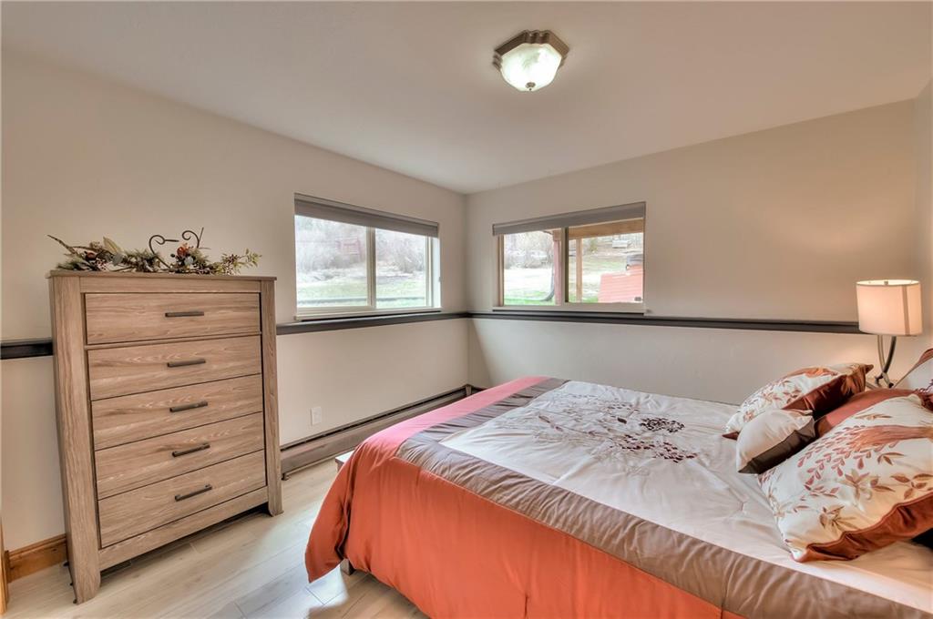 898 Deer Path Road Dillon, CO 80435 - Photo 26 of 34 a bedroom with a bed and a window