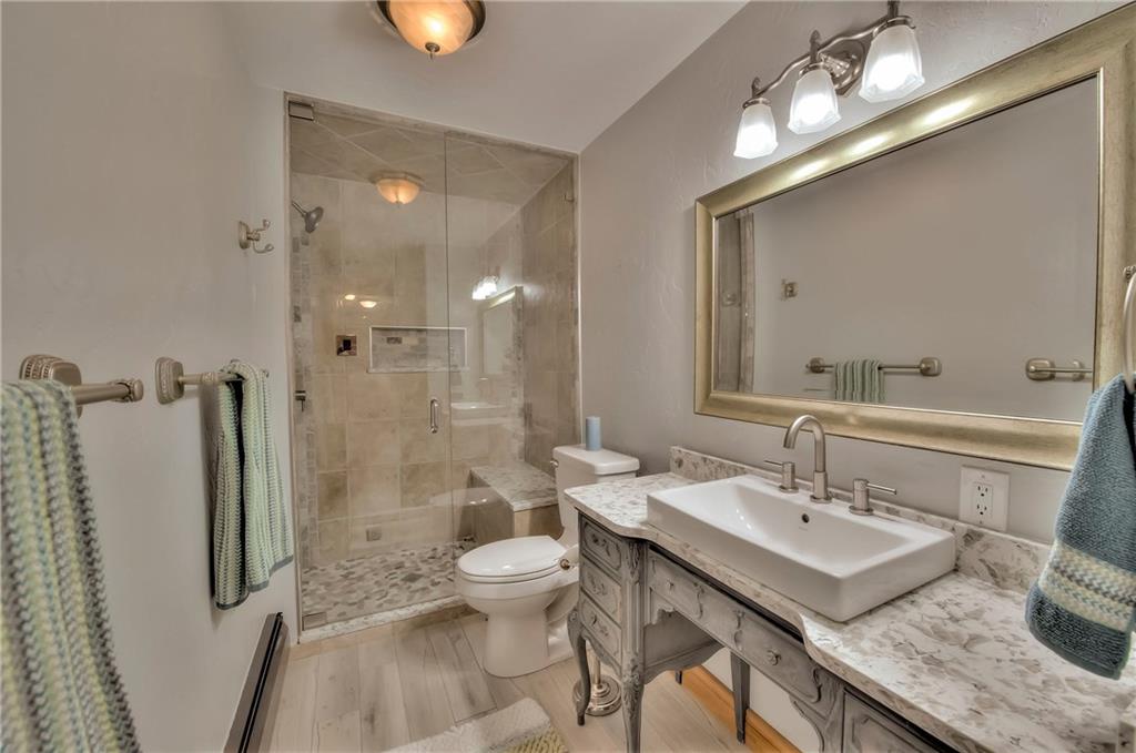 898 Deer Path Road Dillon, CO 80435 - Photo 30 of 34 a bathroom with a sink a toilet and shower