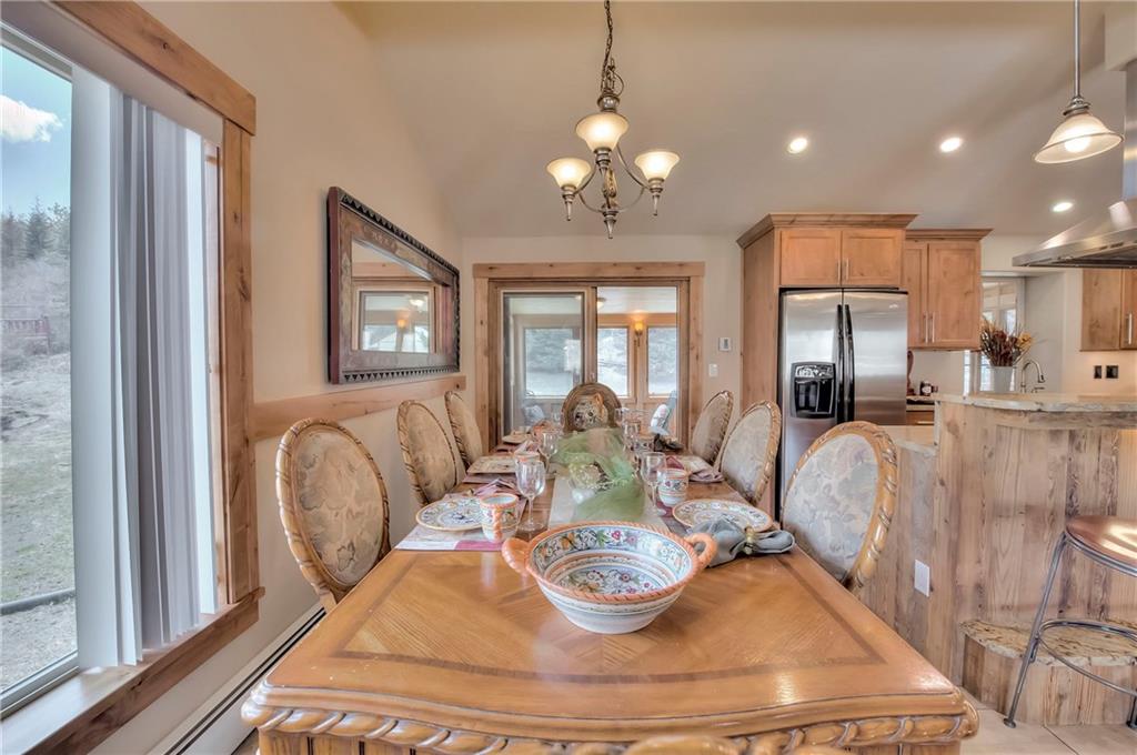898 Deer Path Road Dillon, CO 80435 - Photo 9 of 34 a living room with furniture and a chandelier