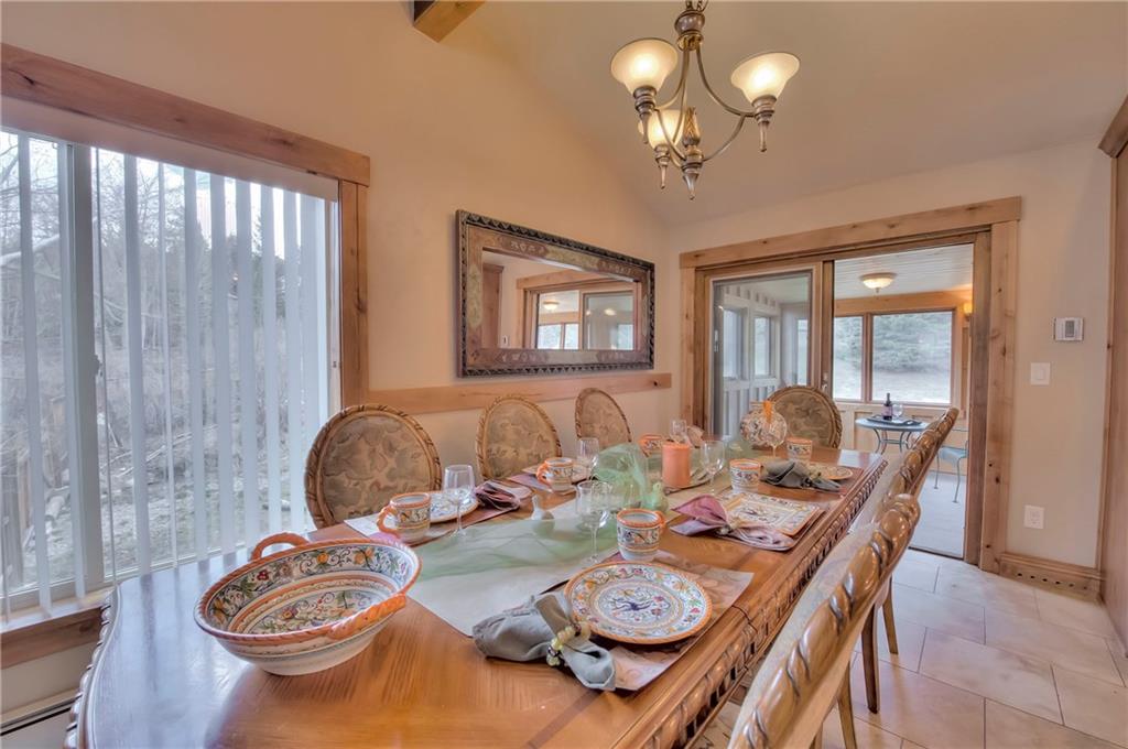 898 Deer Path Road Dillon, CO 80435 - Photo 10 of 34 a dining room with furniture a large window and wooden floor
