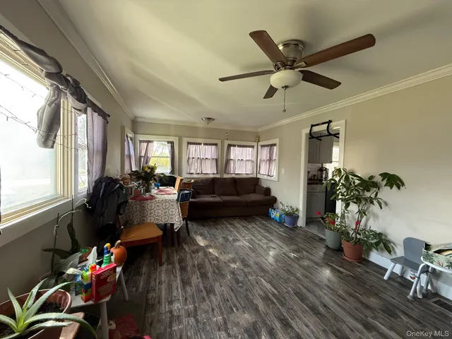 a living room with furniture window and wooden floor