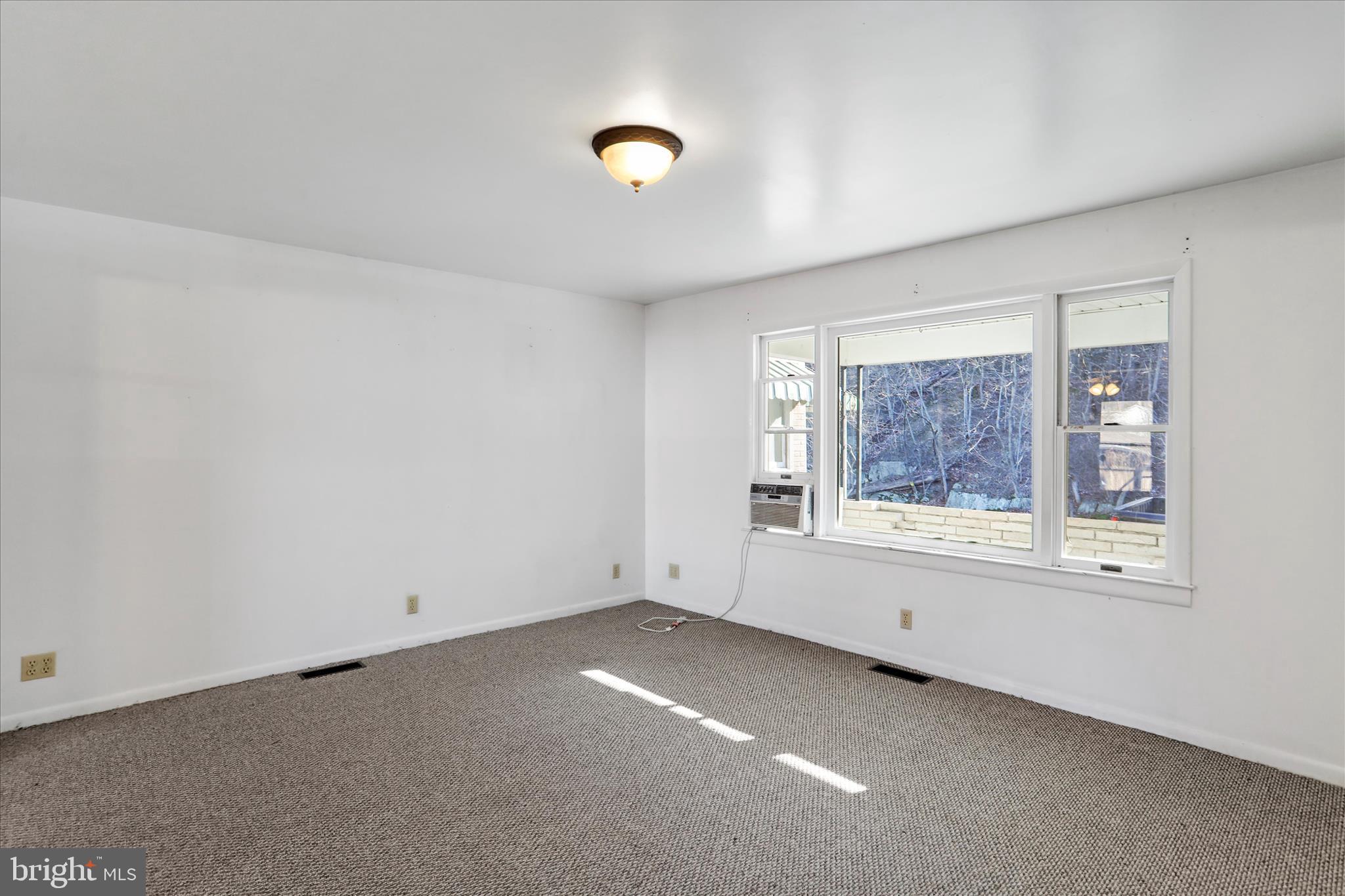 574 South Water Street Keyser, WV 26726 - Photo 4 of 25 an empty room with windows