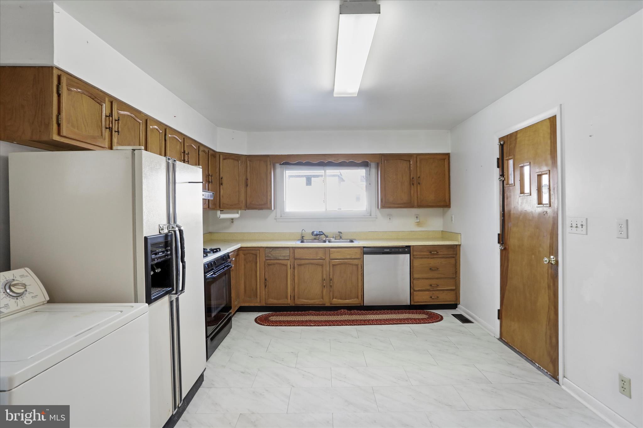 574 South Water Street Keyser, WV 26726 - Photo 10 of 25 a kitchen with a refrigerator sink and stove