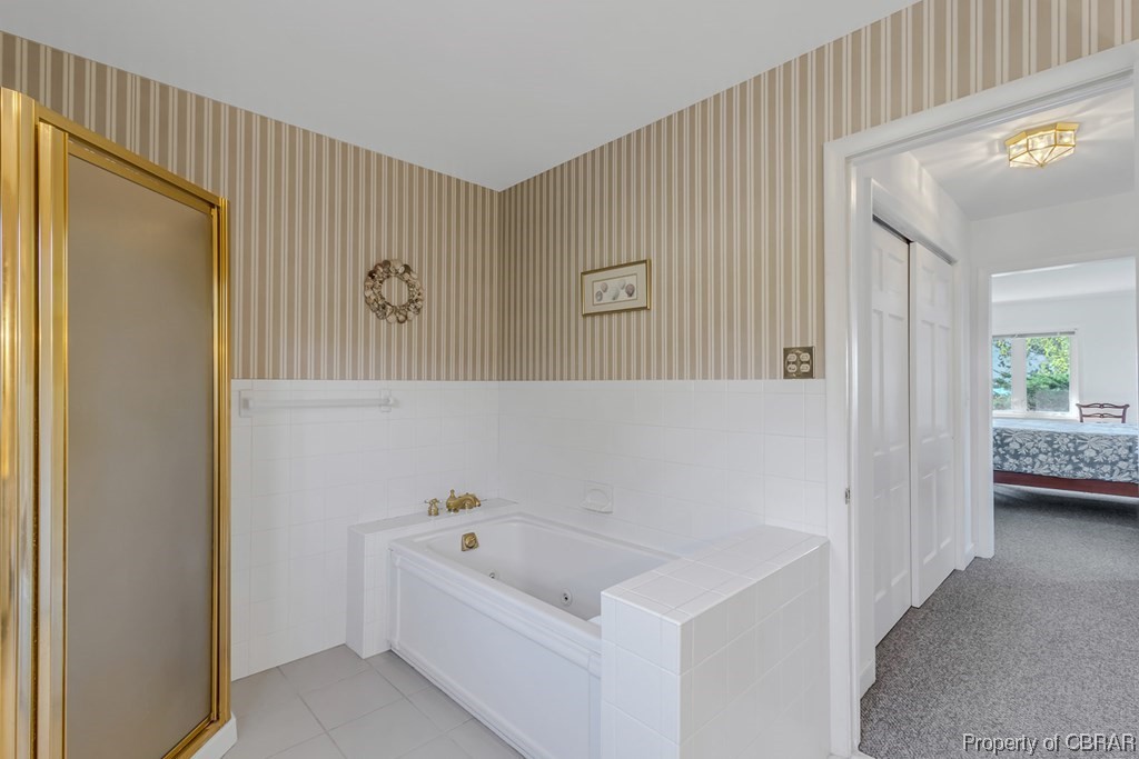 1057 Monaskon Road Lancaster, VA 22503 - Photo 30 of 43 Bathroom featuring separate shower and tub and tile flooring