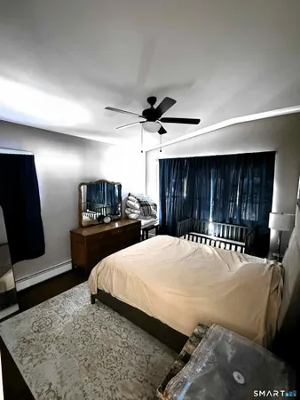 a bedroom with a bed and a television in it