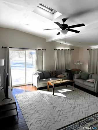 a living room with furniture and a rug
