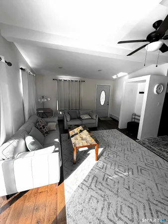 a large bathroom with a large mirror vanity and sink