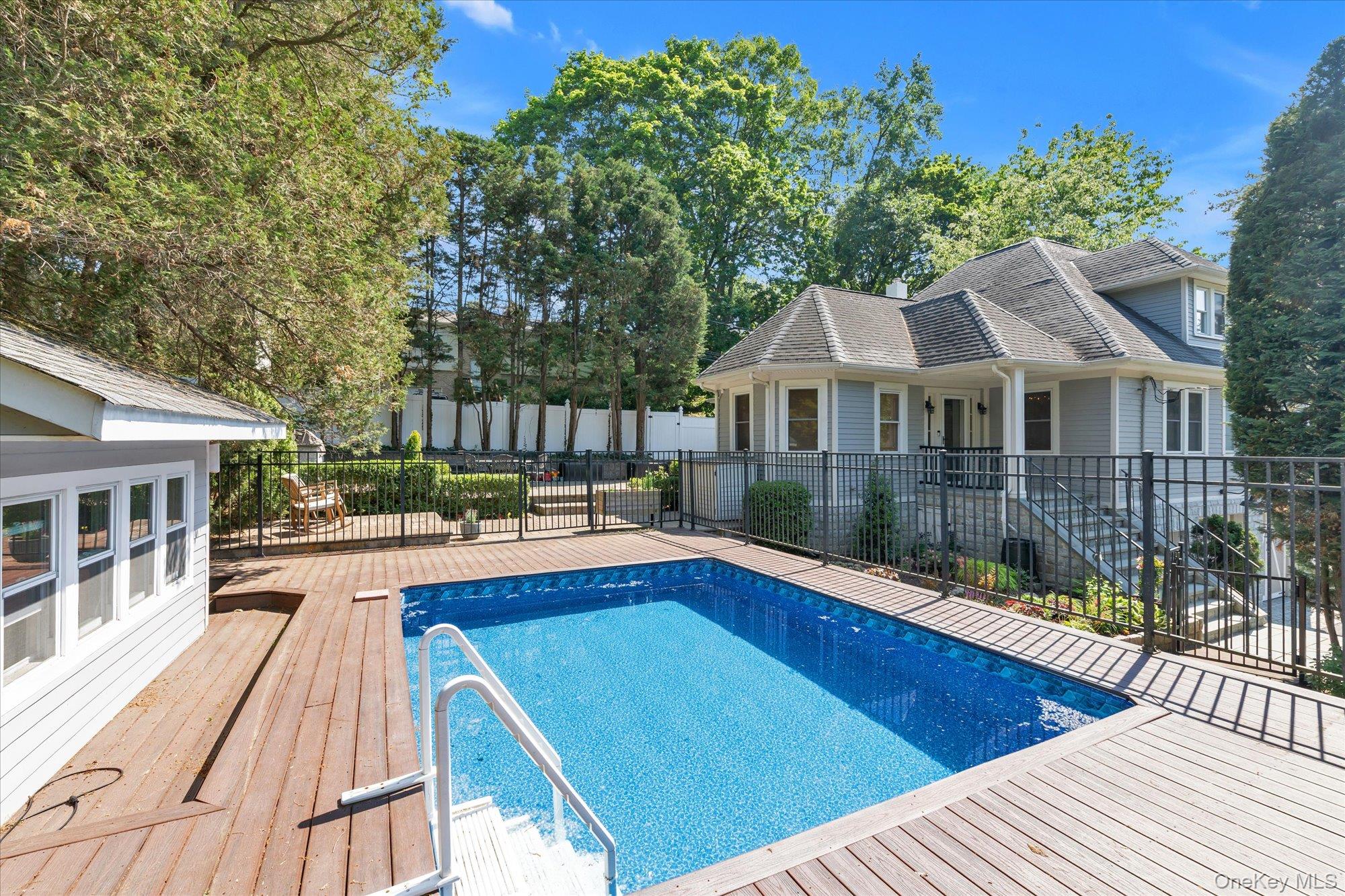 80 Skunks Misery Road Locust Valley, NY 11560 - Photo 25 of 25 a view of a house with pool and sitting area
