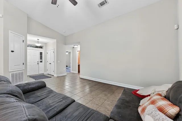 a living room with furniture and a rug