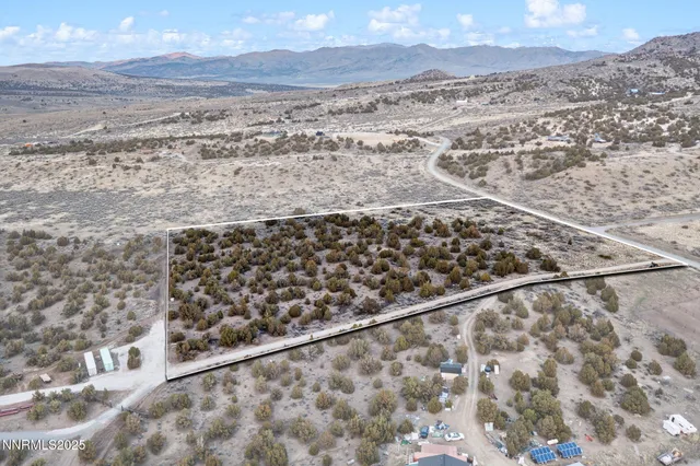 a view of a yard from a balcony