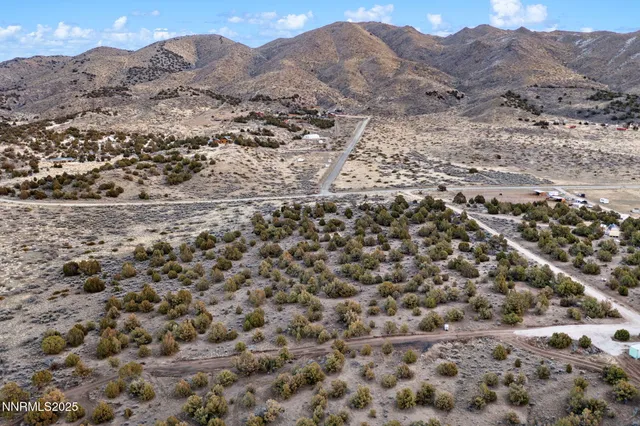 an aerial view of houses with yard