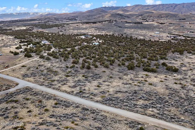 a view of a mountain with mountains in the background