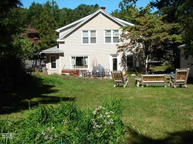 9 Kruskyville Road Bridgewater, CT 06752 - Photo 1 of 1 a view of a white house with a yard table and chairs