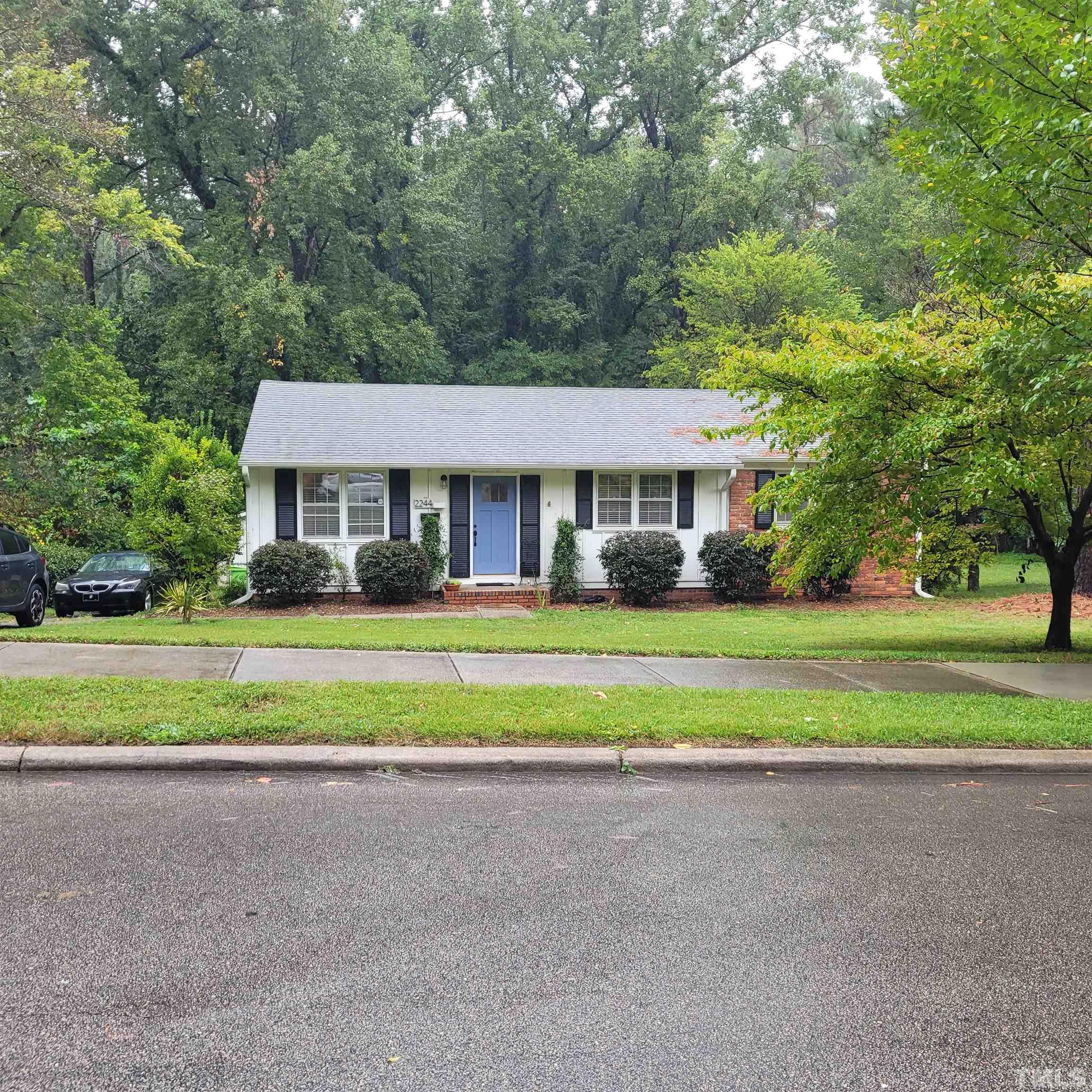 2244 Rumson Road Raleigh, NC 27610 - Photo 3 of 3 a house view with swimming pool and garden space