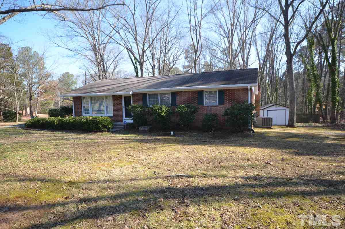 4905 Revere Road Durham, NC 27713 - Photo 1 of 24 a front view of a house with garden