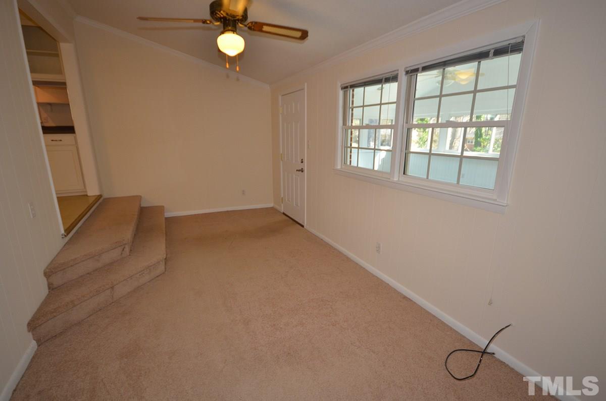 4905 Revere Road Durham, NC 27713 - Photo 13 of 24 an empty room with windows and fan