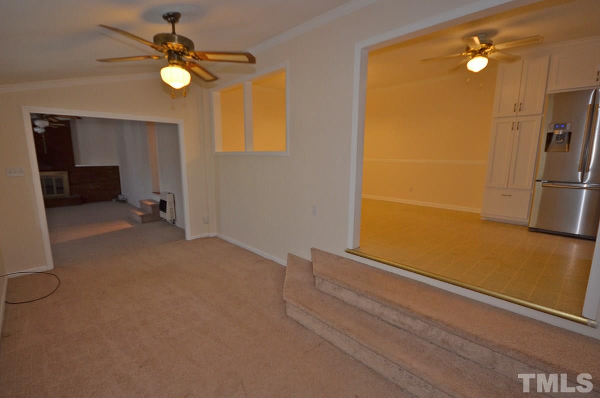 4905 Revere Road Durham, NC 27713 - Photo 14 of 24 a view of empty room with a fireplace