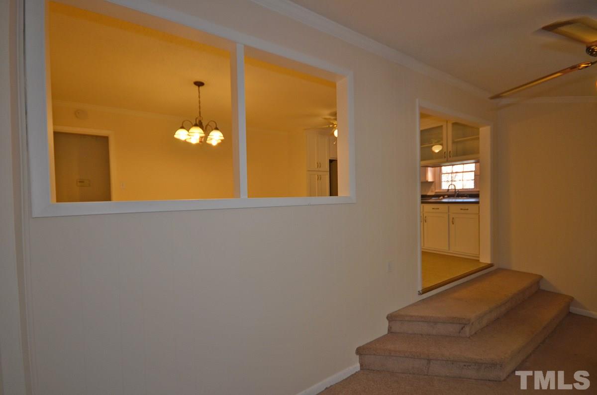 4905 Revere Road Durham, NC 27713 - Photo 15 of 24 a view of a livingroom with wooden floor