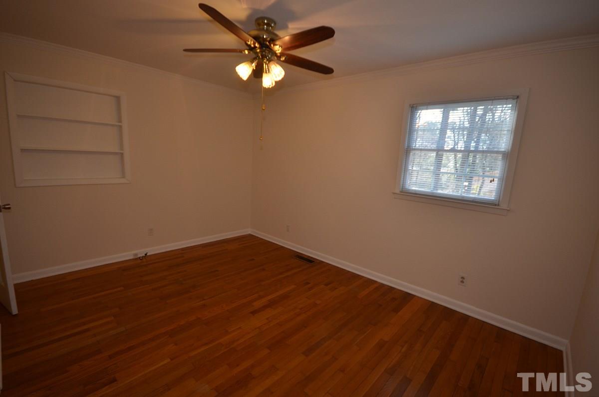 4905 Revere Road Durham, NC 27713 - Photo 19 of 24 an empty room with wooden floor and windows