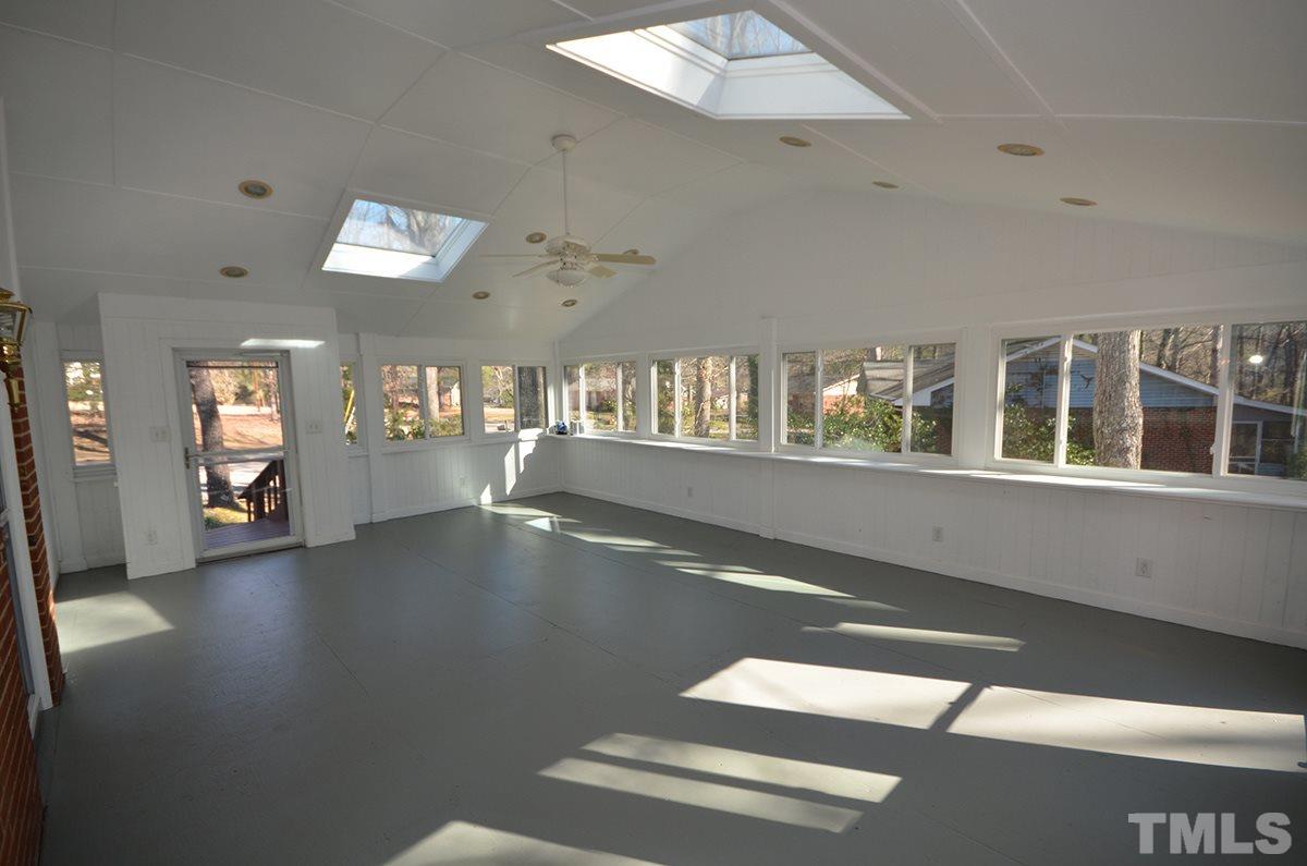 4905 Revere Road Durham, NC 27713 - Photo 23 of 24 an empty room with wooden floor and windows
