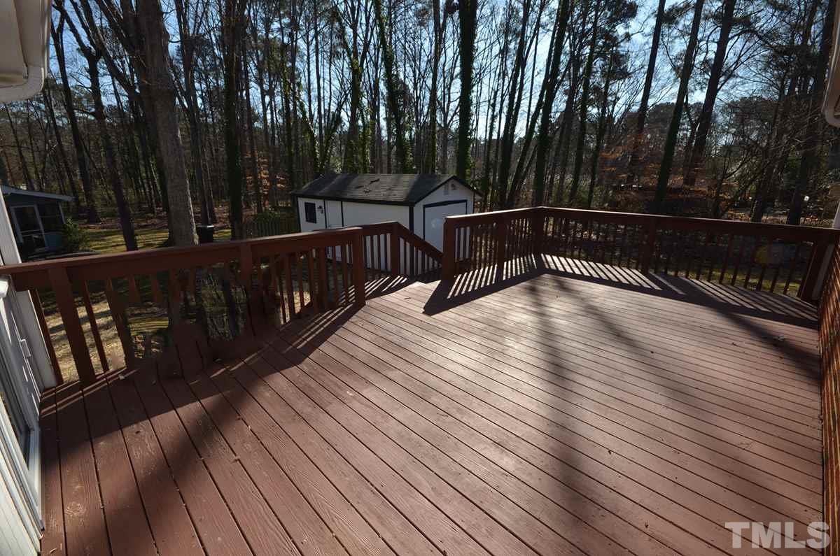 4905 Revere Road Durham, NC 27713 - Photo 24 of 24 a view of deck with wooden floor and outdoor seating