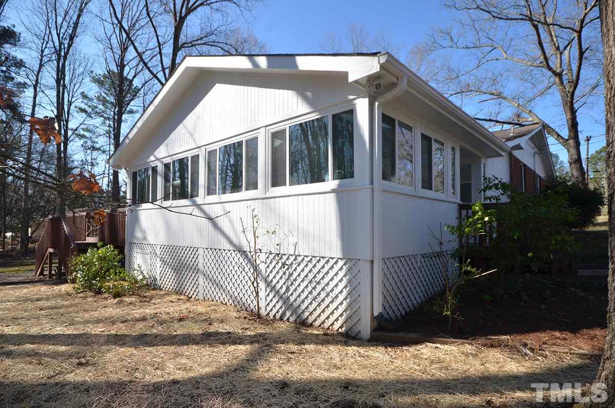 4905 Revere Road Durham, NC 27713 - Photo 4 of 24 a view of a house with a wooden fence