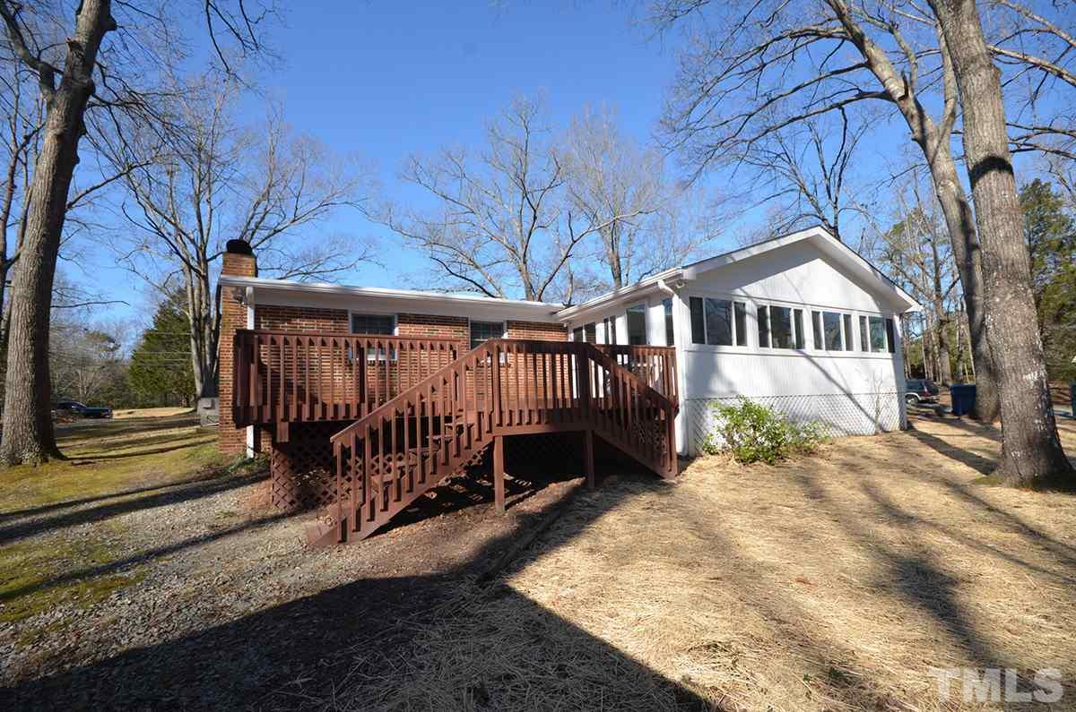 4905 Revere Road Durham, NC 27713 - Photo 5 of 24 a view of a house with a yard