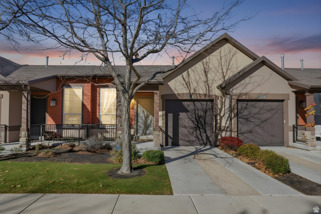 14820 175 East Draper, UT 84020 - Photo 33 of 39 Single story home with concrete driveway, covered porch, a front lawn, a shingled roof, and stucco siding