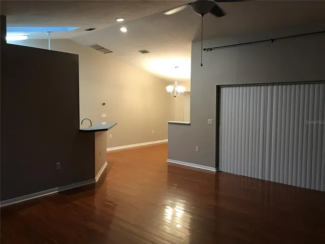 a view of a livingroom with wooden floor