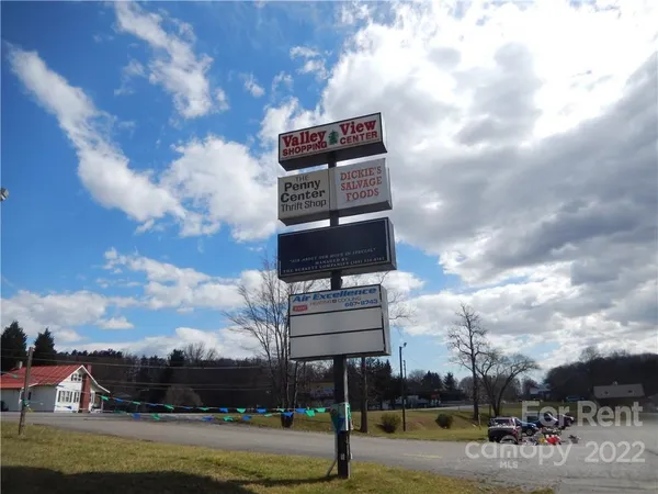 a front view of a residential apartment building with a yard