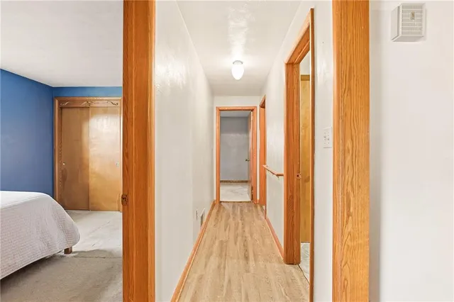 a view of a bathroom from a hallway