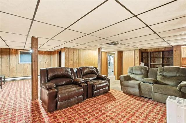 a living room with lots of furniture and a chandelier