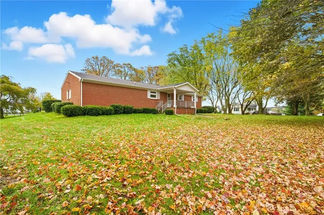 a sign board with yard in front of it