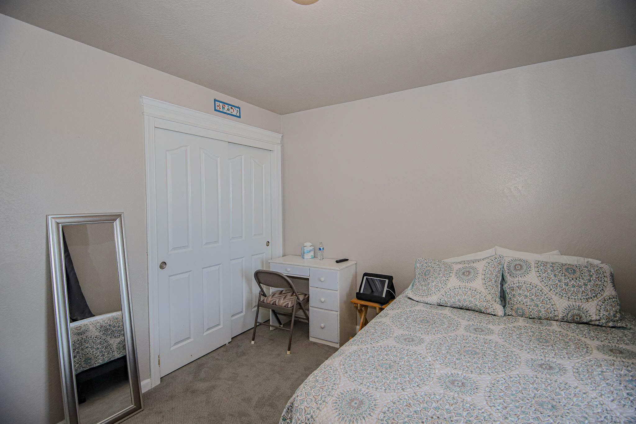 623 Barton Road Eagle Point, OR 97524 - Photo 21 of 28 a bedroom with a bed and a chair