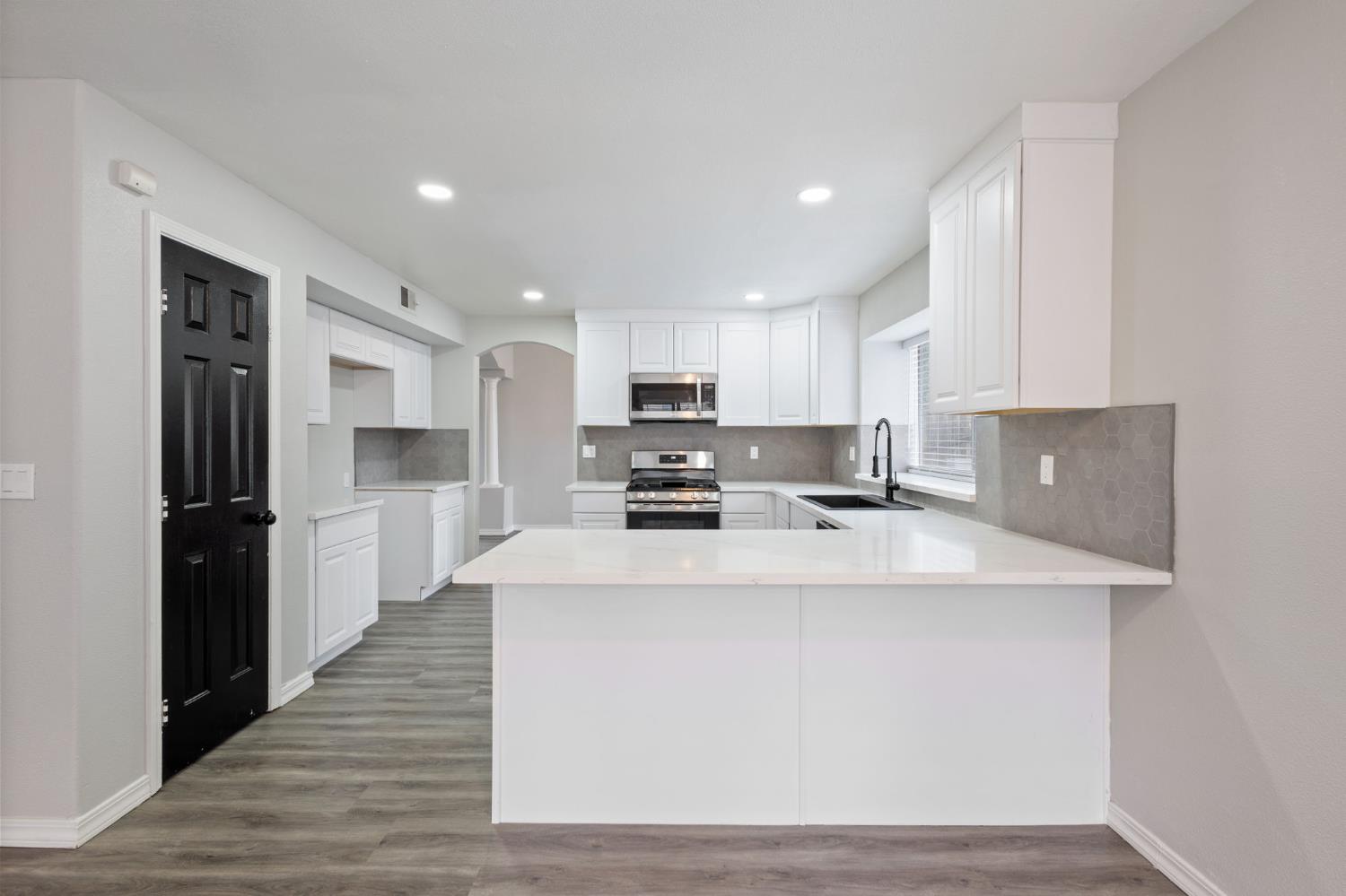 7300 Saltgrass Way Elk Grove, CA 95758 - Photo 14 of 35 a large kitchen with stainless steel appliances
