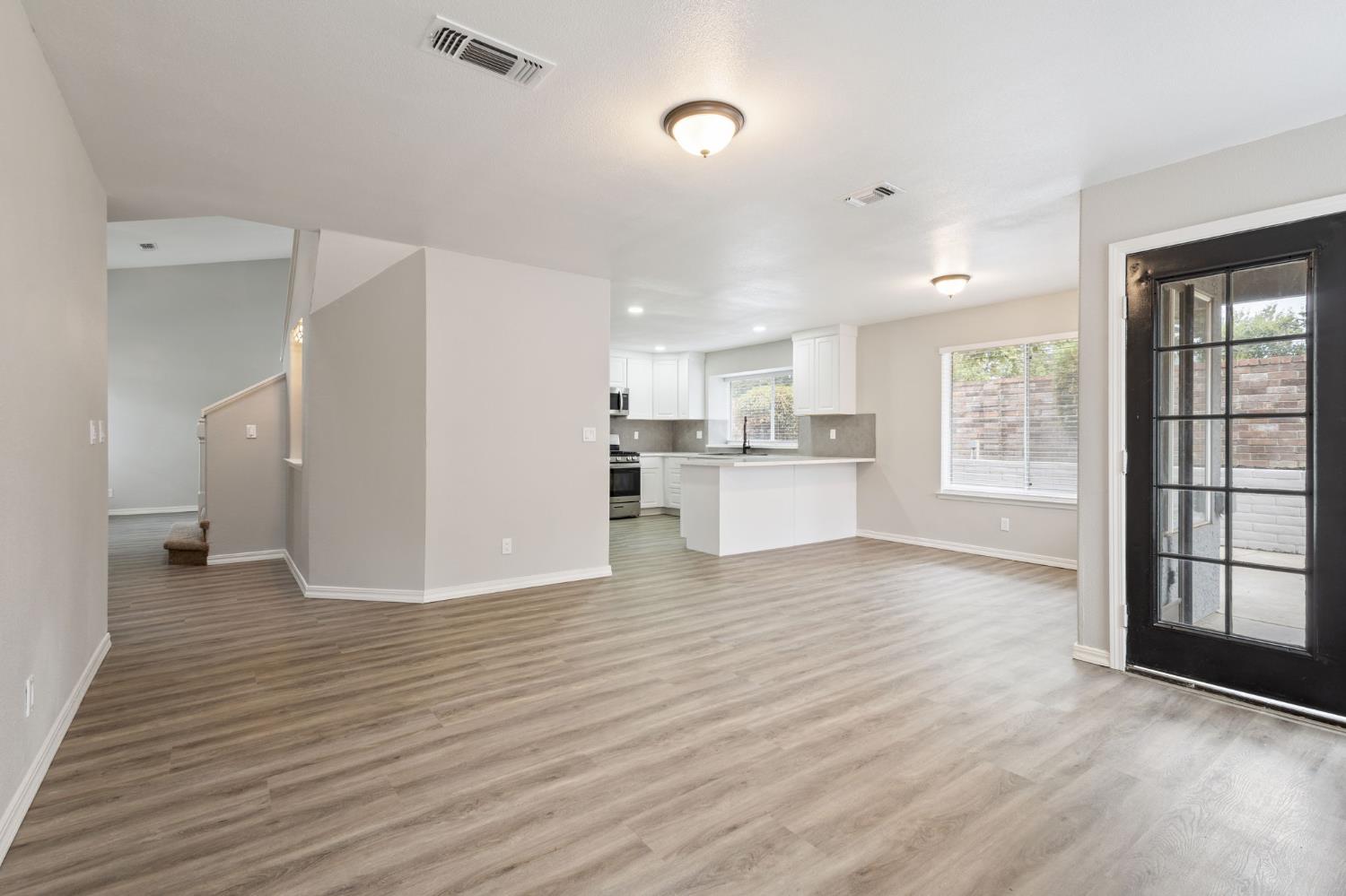 7300 Saltgrass Way Elk Grove, CA 95758 - Photo 18 of 35 a view of a kitchen with wooden floor and a window