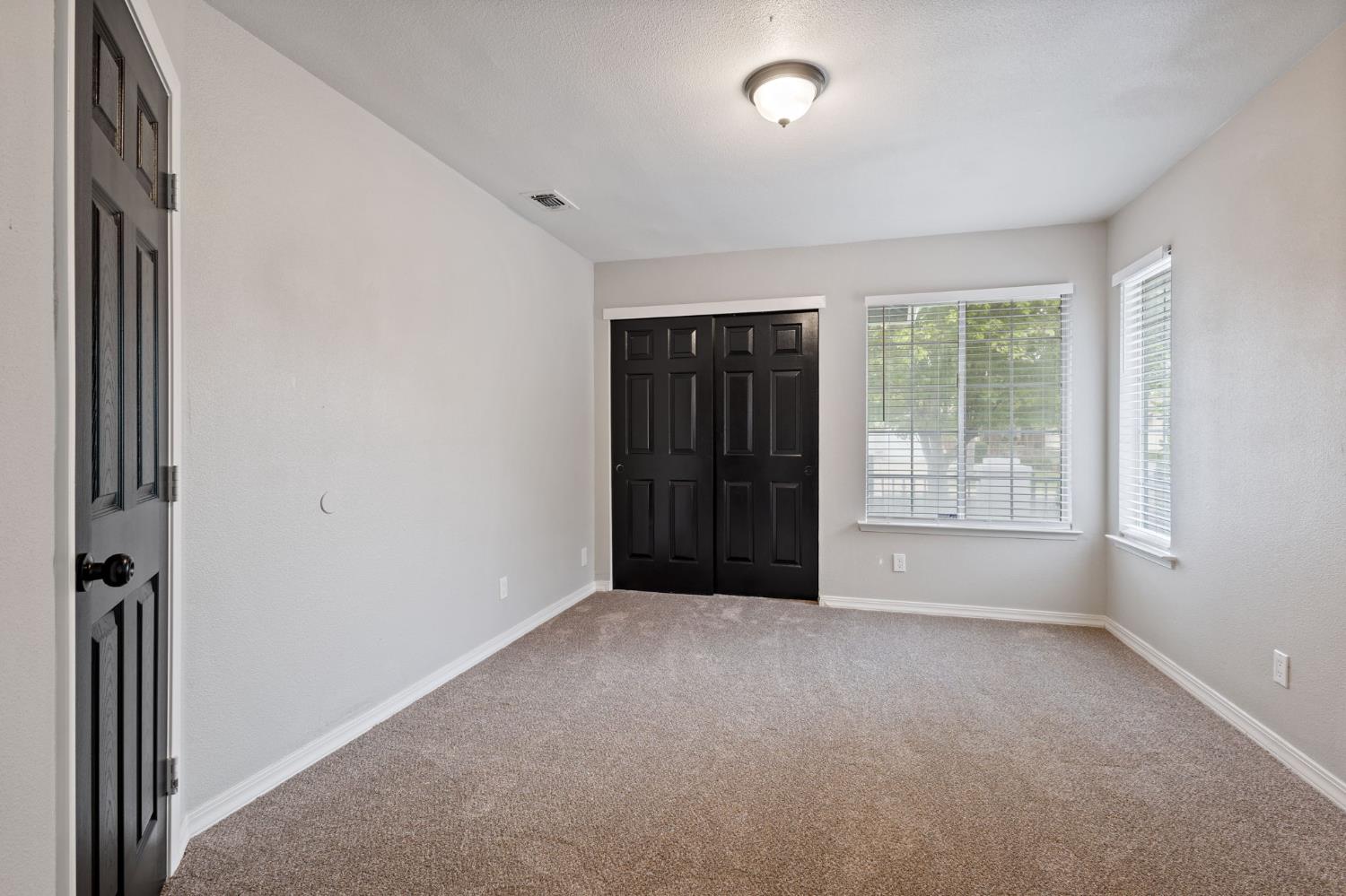 7300 Saltgrass Way Elk Grove, CA 95758 - Photo 21 of 35 a view of an empty room with a window