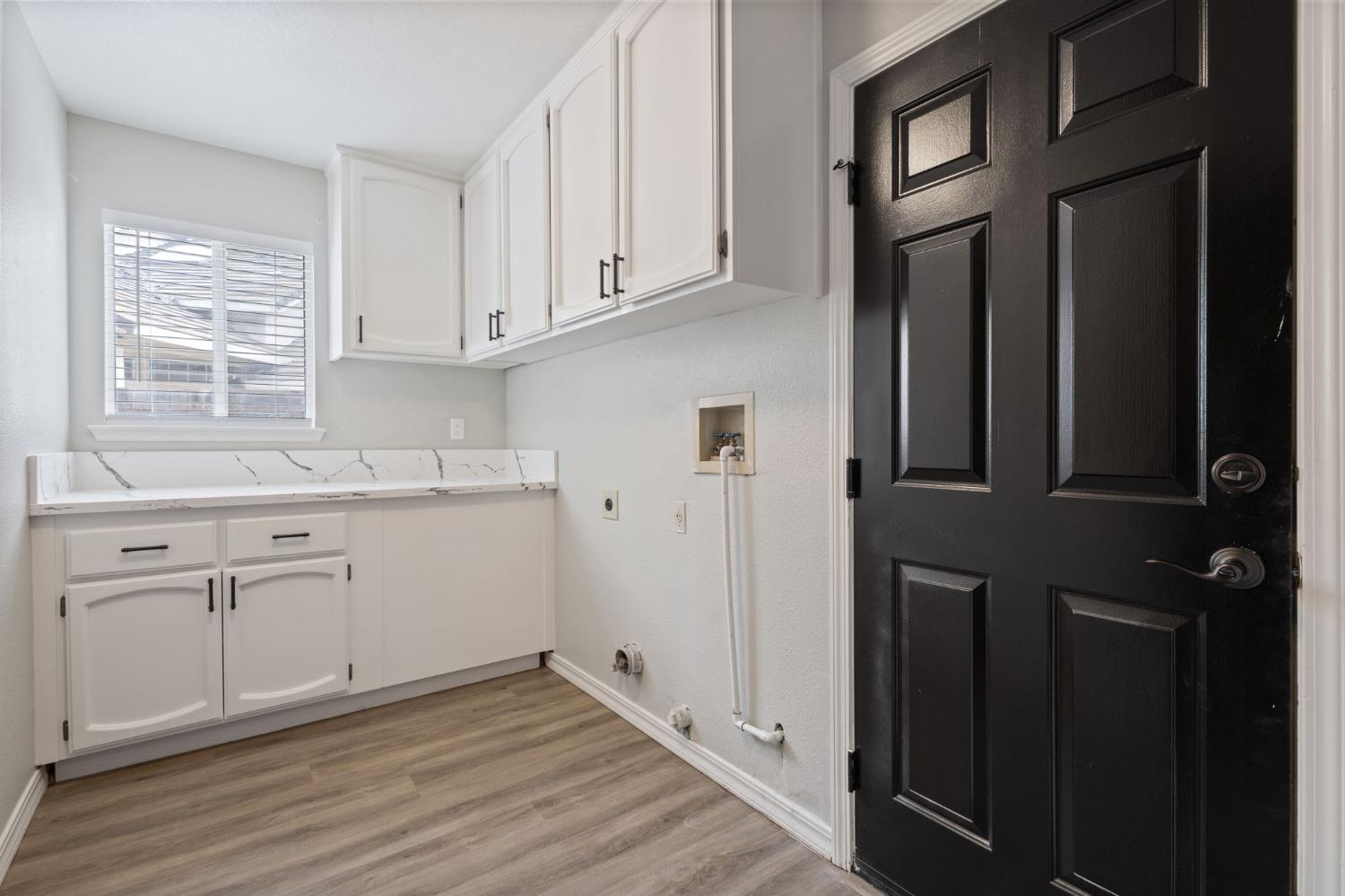 7300 Saltgrass Way Elk Grove, CA 95758 - Photo 22 of 35 a kitchen with granite countertop white cabinets and white appliances