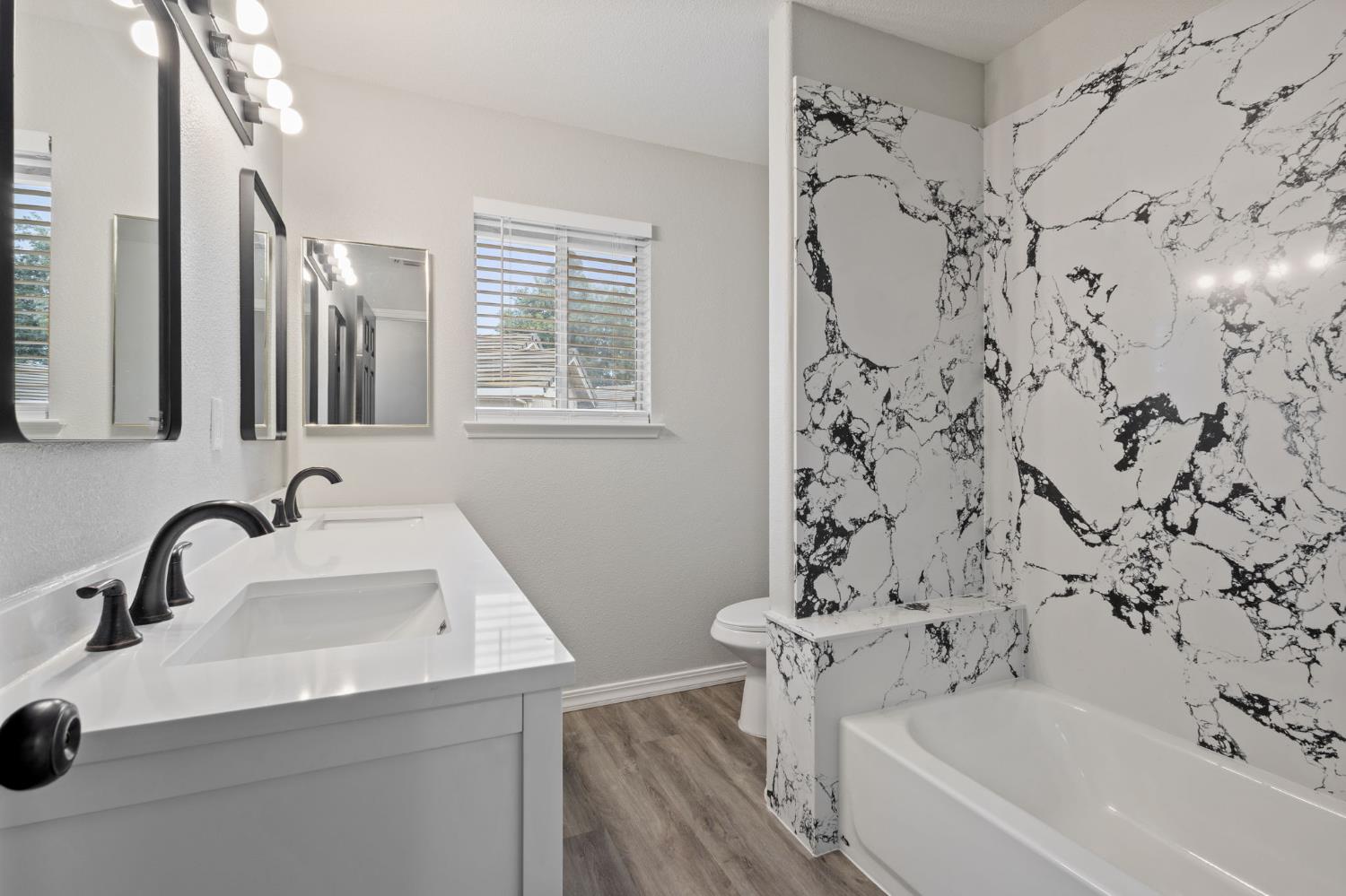 7300 Saltgrass Way Elk Grove, CA 95758 - Photo 24 of 35 a bathroom with a sink and a bathtub