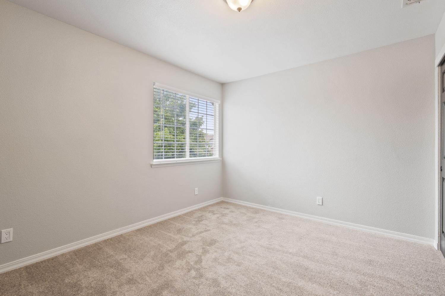 7300 Saltgrass Way Elk Grove, CA 95758 - Photo 25 of 35 an empty room with windows