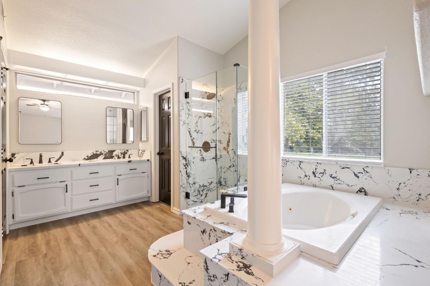 7300 Saltgrass Way Elk Grove, CA 95758 - Photo 30 of 35 a spacious bathroom with a tub sink shower and mirror