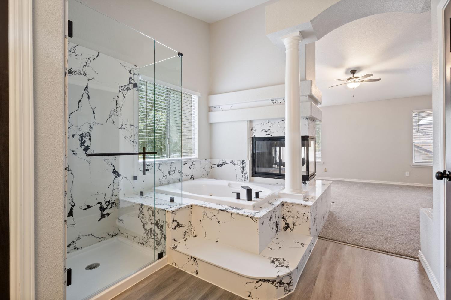 7300 Saltgrass Way Elk Grove, CA 95758 - Photo 31 of 35 a bathroom with a bathtub sink and mirror