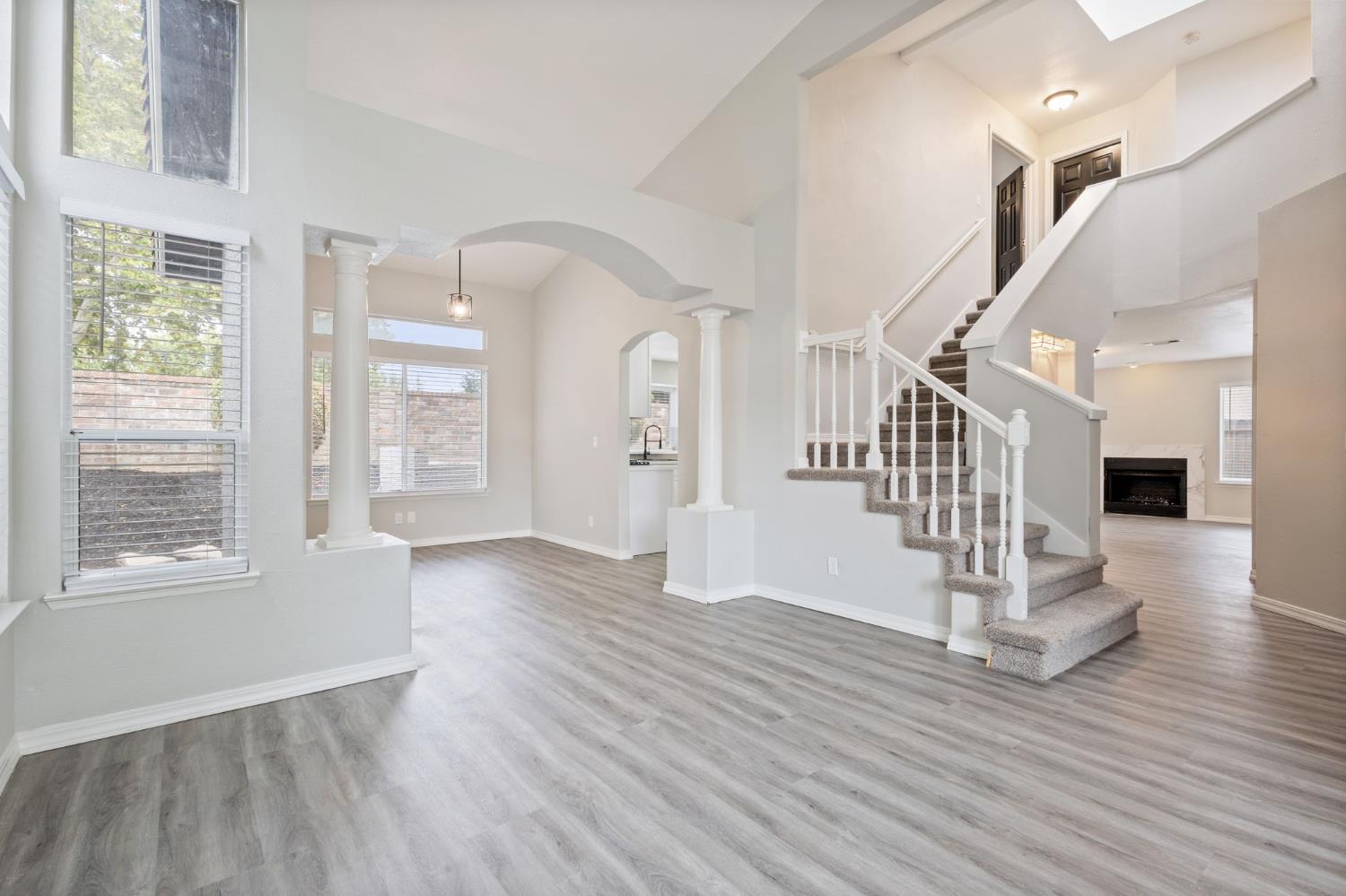 7300 Saltgrass Way Elk Grove, CA 95758 - Photo 7 of 35 a view of empty room with wooden floor and fan